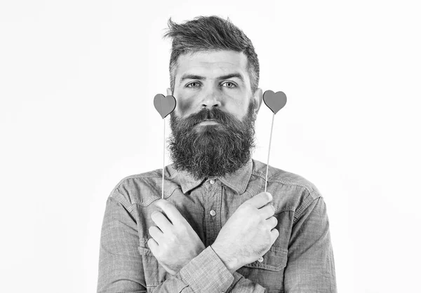Brutal man with long beard and red hearts. — Stock Photo, Image