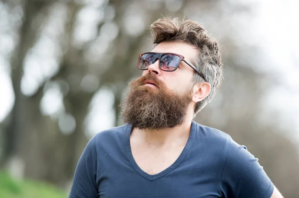 Barber concept. Man bearded with mustache serious face confident nature background. Bearded man with sunglasses. Hipster bearded confident in dark fashionable sunglasses. Bearded hipster brutal macho — Stock Photo, Image