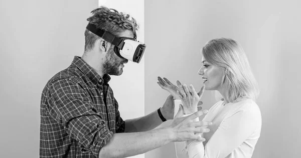 Video game captured imagination of guy. Wife tries to help him back into real life. Man VR glasses involved video game while girl try to wake him up. Video game addiction symptoms and treatment