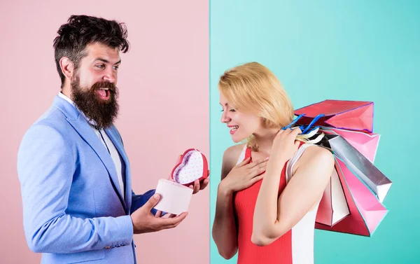 Man bearded hipster hold gift box and girl enjoy shopping. Ask man to purchase lots presents for girlfriend. Couple with luxury bags in shopping mall. Couple enjoy shopping. Everything she wants — Stock Photo, Image