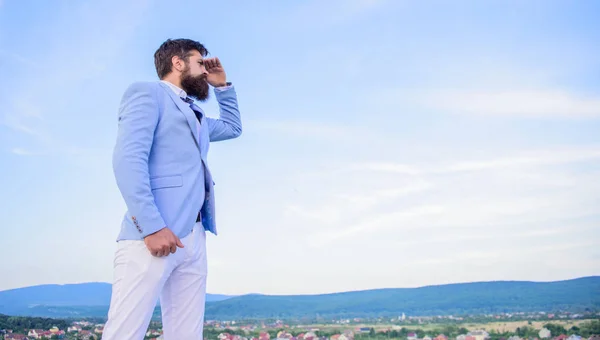 Changing course. New business direction. Looking for opportunities and new chances. Man formal suit manager looking direction. Developing business direction. Businessman bearded face sky background