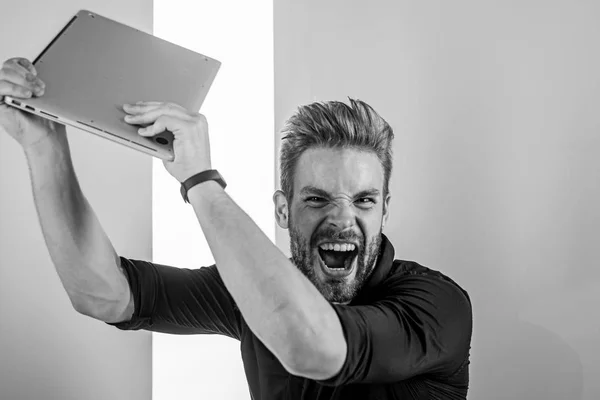 Annoying advertisement promoting brands on internet makes people go crazy angry aggressive. Man laptop annoyed by ads. Internet advertisement. Guy stylish appearance going mad while works laptop — Stock Photo, Image