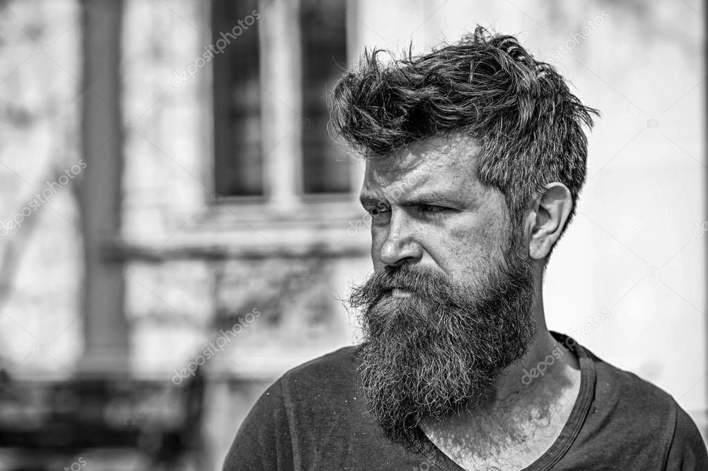 Sadness and problems concept. Man with beard and mustache looks not fresh. Hipster with beard looks unhealthy. Bearded man on strict face looks sad and troubled, suffers from problems