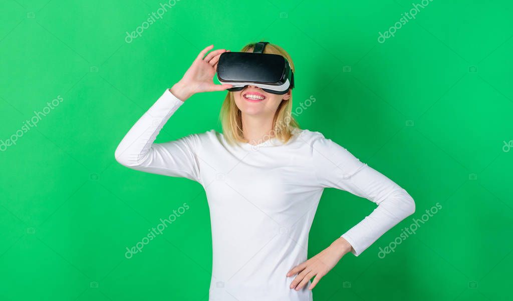 Funny young woman with VR. Excited smiling businesswoman wearing virtual reality glasses. Virtual reality headset.