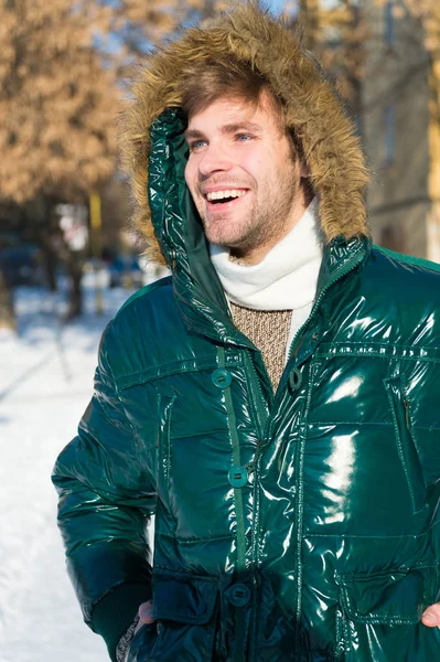Winter fashion. Warm clothes. Happy man on winter holidays. Snowy weather. Trendy winter coat. Vacation and traveling in winter. Man. It is cold outside. Forest in snow. Fresh air. Feeling frosty — Stock Photo, Image