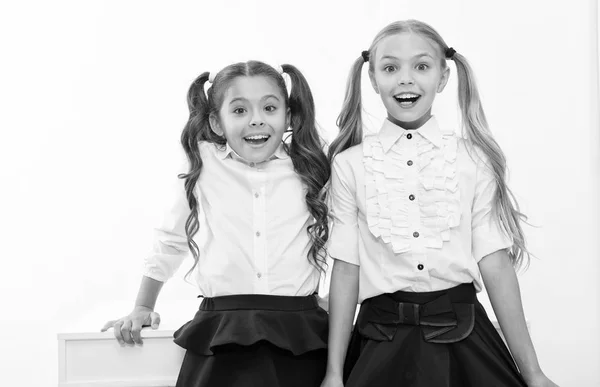 Back to school is here. Little girls happy to be back to school. happy little girls.