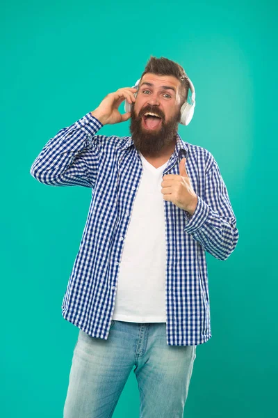 Man in earphones. Young and brutal. Bearded man. Hair and beard care. Mature hipster with beard. Happy man hipster listen to music. music. brutal caucasian hipster with moustache. my favorite song — Stock Photo, Image