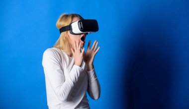 3d technology, virtual reality, entertainment, cyberspace and people concept. Confident young woman adjusting her virtual reality headset and smiling. Woman using virtual reality headset. clipart