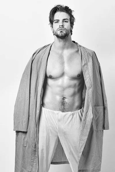 Macho in blue bathrobe with strong muscular body. — Stock Photo, Image