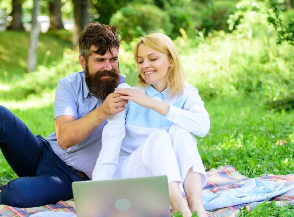 How to balance freelance and family life. Couple in love or family work freelance. Freelance life benefit concept. Modern online business. Couple youth spend leisure outdoors working with laptop