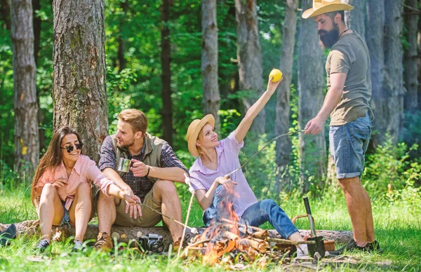 Camping and hiking. Company friends relaxing and having snack picnic nature background. Great weekend in nature. Company hikers relaxing at picnic forest background. Halt for snack during hiking — Stock Photo, Image