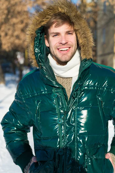 Man. It is cold outside. Forest in snow. Fresh air. Vacation and traveling. Happy man on winter holidays. Snowy weather. Trendy winter coat. Winter fashion. Warm clothes. Shopping in any weather — Stock Photo, Image