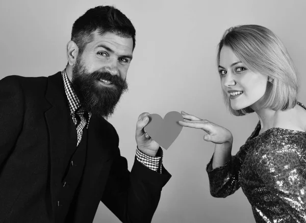 Boyfriend shares his love with girlfriend. Girl and bearded man