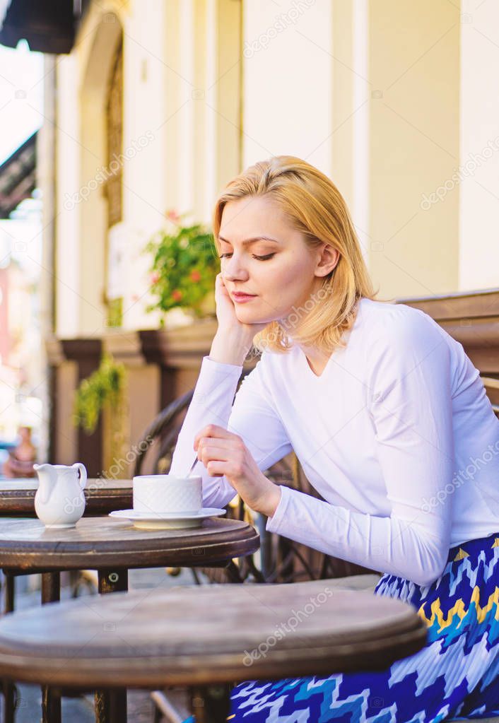 Woman lonely wait date. Dating advice for women. Still waiting him. How enjoy being single tips. Woman sits alone cafe terrace urban background defocused. Girl sit alone cafe waiting him