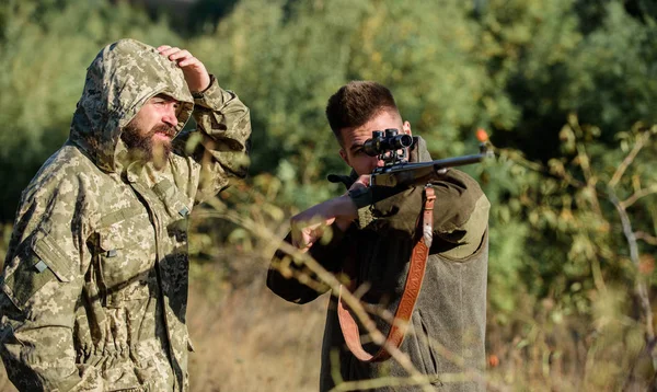 Poaching concept. Activity for brutal men. Hunters poachers looking for victim. Poachers with rifles in nature environment. Illegal hunting. Hunters brutal poachers. Forbidden hunting. Breaking law — Stock Photo, Image