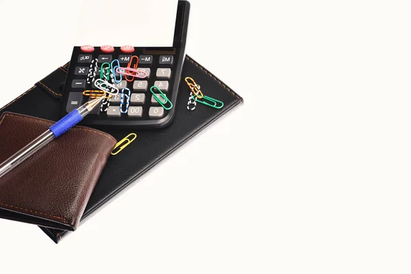 Skinn omfattas notebook, plånbok och kalkylator som affärsidé — Stockfoto