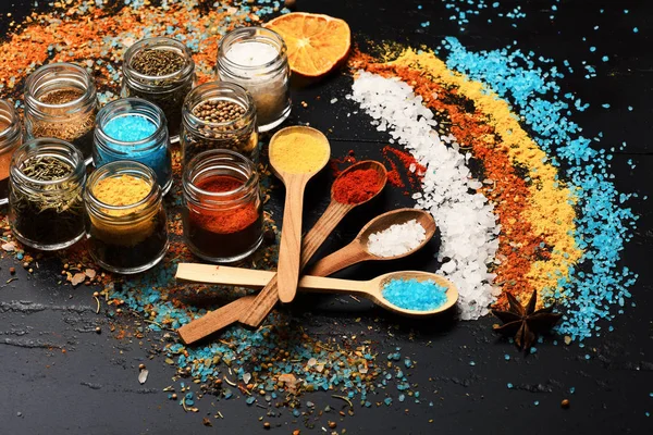 Set of spices on grey background. Composition of colored salt — Stock Photo, Image