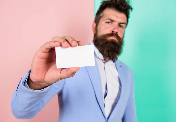 Card copy space professional occupation position. Feel free contact me. Businessman hold blank card. Bearded hipster serious face show card. Banking services for business. Business card design