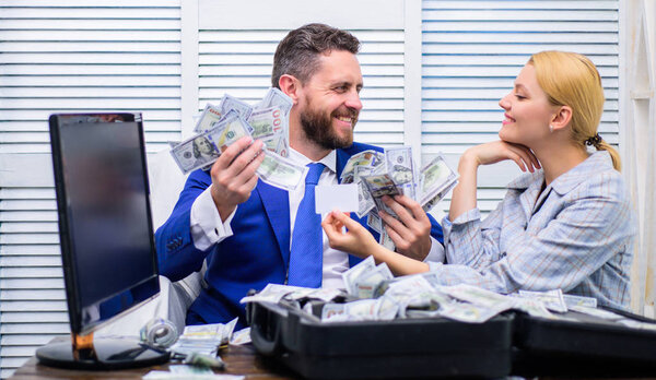 Business, people and finances concept. Dirty money holded in hands by happy businessman. Businessman with money on office room.