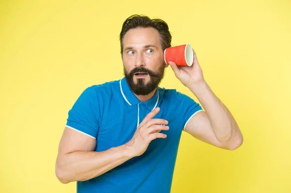 Mature hipster with beard. brutal caucasian hipster with moustache. Bearded man. Male barber care. secret. gossip man. man listening through the coffee cup. hide from neighbors — Stock Photo, Image