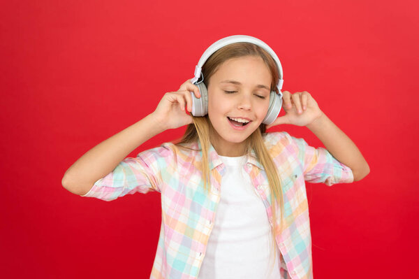 Girl child listen music modern headphones. Get music account subscription. Enjoy music concept. Music always with me. Leisure concept. Little girl listen song headphones. Online radio station channel