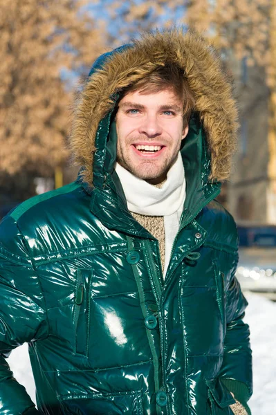 Winter fashion. Warm clothes. Snowy weather. Trendy winter coat. Vacation and traveling in winter. Man. It is cold outside. Forest in snow. Fresh air. man on winter holidays. Capturing a happy moment