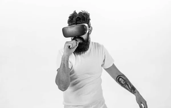 Man with beard in VR glasses, white background. Guy with VR glasses singing with virtual microphone. VR musician concept. Hipster on busy face use modern technologies for entertainment or education — Stock Photo, Image