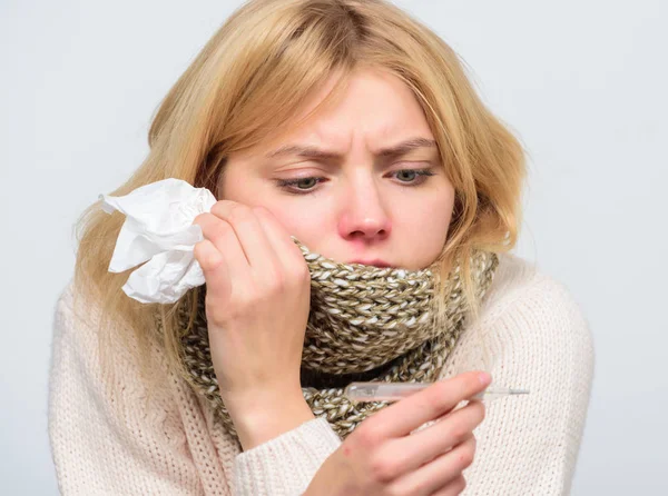 Seasonal flu concept. Woman feels badly. How to bring fever down. Fever symptoms and causes. Sick girl with fever. Girl sick hold thermometer and tissue. Measure temperature. Break fever remedies — Stock Photo, Image