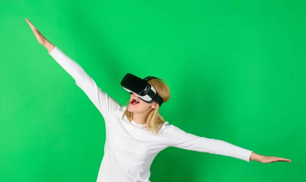 Woman excited using 3d goggles. Woman wearing virtual reality goggles. Woman with virtual reality headset. Game VR.