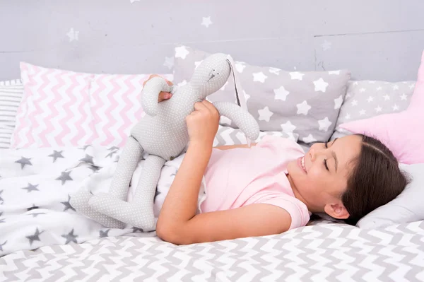 Lullaby concept. Ways to fall asleep faster. Fall asleep as fast as possible. Fall asleep faster and sleep better. Healthy sleep. Sweet dreams. Girl happy child lay bed pillow and blanket bedroom — Stock Photo, Image