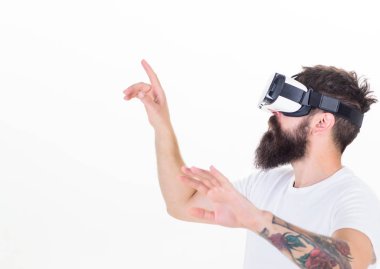 A person in virtual glasses flies in room space. Happy bearded man wearing virtual reality goggles watching movies or playing video games. Futuristic vision concept. clipart