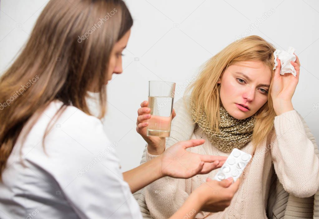 Woman consult with doctor. Girl in scarf hold tissue while doctor offer treatment. Cold and flu remedies. Tips how to get rid of cold. Recognize symptoms of cold. Remedies should help beat cold fast