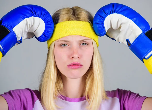 Strong woman suffer pain. Girl painful face embrace head with boxing gloves. Headache remedies. Headache concept. Keep calm and get rid of headache. Beat headache. Girl boxing gloves tired to fight — Stock Photo, Image