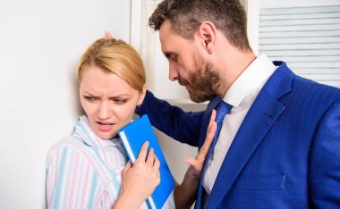 Disrespect. Manager putting his hand on the shoulder of his secretary, at the office. Woman sad face hold poster hashtag me too. clipart