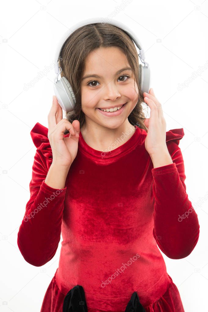 Online music channel. Girl little child use music modern headphones. Listen for free new and upcoming popular songs right now. Music always with me. Little girl listen music wireless headphones