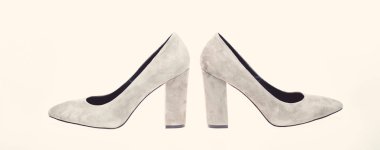Shoes made out of grey suede on white background, isolated. Footwear for women with thick high heels, side view. Female footwear concept. Pair of fashionable high heeled shoes clipart