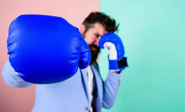 Born to fight. Boxing glove and blurred businessman in formal wear. Fighting for success in sport and business. Bearded man in boxing stance. Sport improves his leadership skills. Strong and powerful