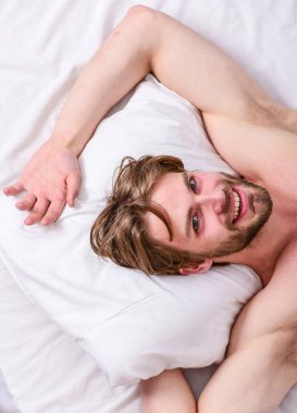 Get adequate and consistent amount of sleep every night. How much sleep you actually need. Bearded man sleeping face relaxing on pillow. Man handsome guy lay in bed. Expert tips on sleeping better clipart