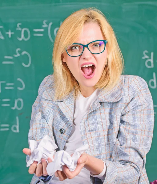 Woman teacher holds crumpled pieces of paper. Fed up of fails. Trial and error is fundamental method of problem solving. Teacher screaming face holds pieces of paper with mistakes wrongly solved test — Stock Photo, Image