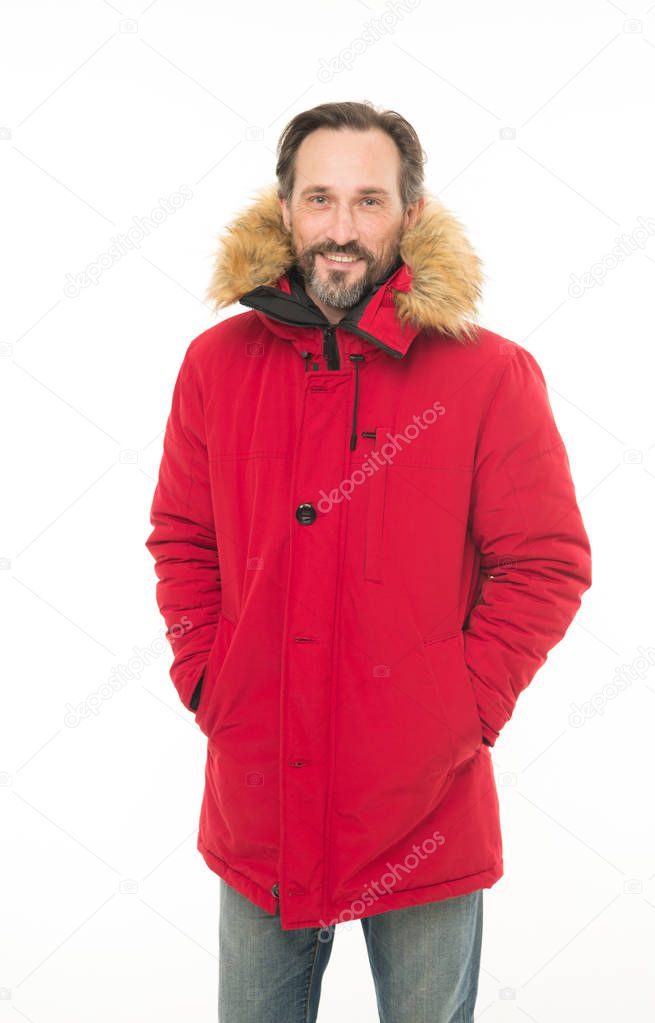Keep warm. Winter stylish menswear. Man bearded hipster wear warm jacket with fur white background. Guy wear warm jacket with hood. Feel comfortable in warm clothing. Comfortable winter clothing