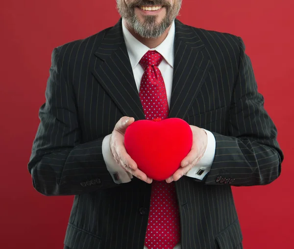 All my love is for you. diseased heart. Love and romance health care. mature man hold valentines heart. February holiday. Happy man with big red heart. businessman in suit. success and fortune