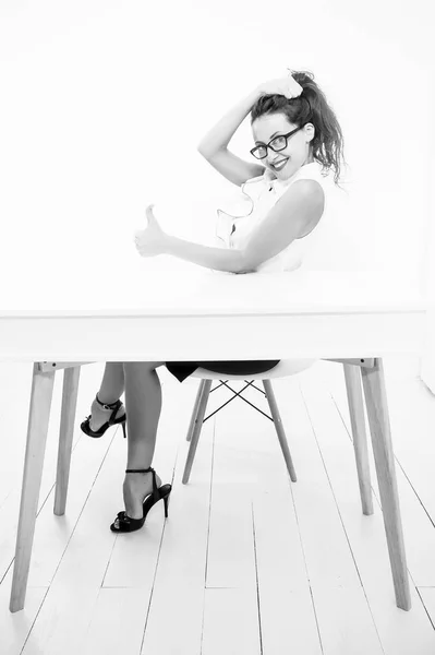 anti-crisis manager. back to school. Charming lady smiling at table. Business success. sexy woman with red lips in glasses. business school teacher or student. School curriculum. Ready to success