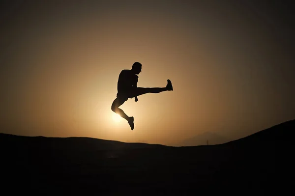 Silhouette of sportsman — Stock Photo, Image