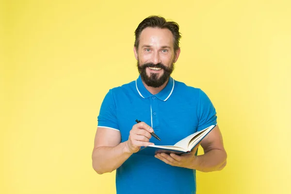 Man mature bearded guy writing notes to notepad. Check what is done. Daily schedule. Developing habits and set up routine. Checklist of tasks. Daily checklist to do and done. Helpful checklist — Stock Photo, Image