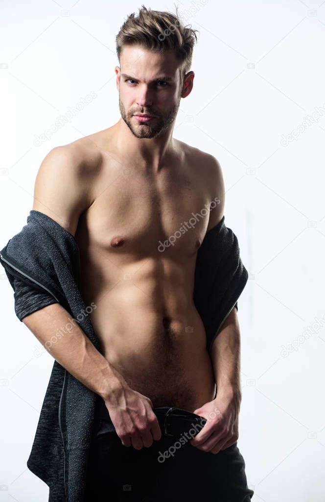 Unleashed desire. Seductive macho feeling sexy. Attractive sexy body. Confident in his attractiveness. Time change clothes. Man handsome sexy undressing. Hipster sexy muscular torso take off clothes