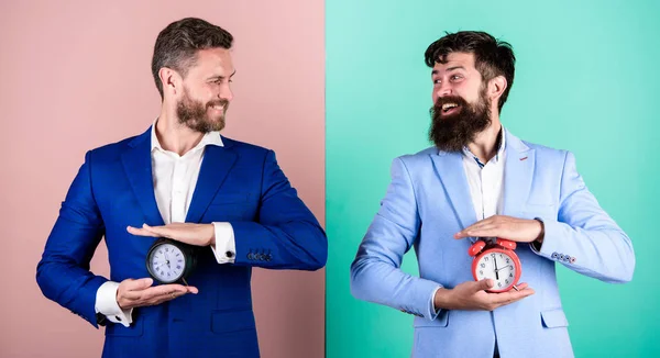 Control and discipline. Build your self discipline. Men business formal suits hold alarm clocks. Lack of self discipline in time management leads people to procrastinate. Take control of your habits — Stock Photo, Image