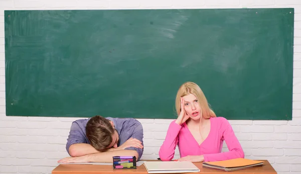 School curriculum. Student life. Lesson and blackboard. Teachers day. Couple of man and woman in classroom. Home schooling. Modern school. Knowledge day. Back to school. tired couple — Stock Photo, Image
