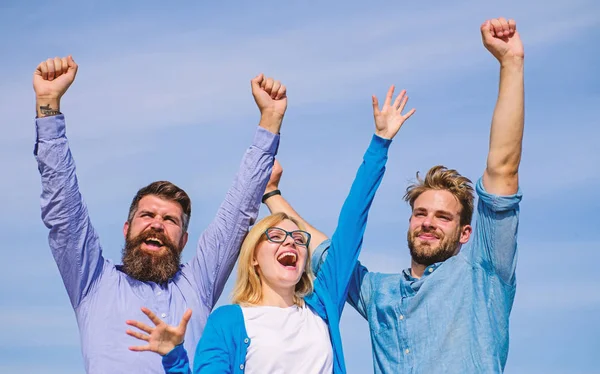 Employees enjoy feeling of freedom. Freedom concept. Men with beard in formal wear and girl finished working week. Company happy colleagues office workers enjoy freedom friday evening, sky background