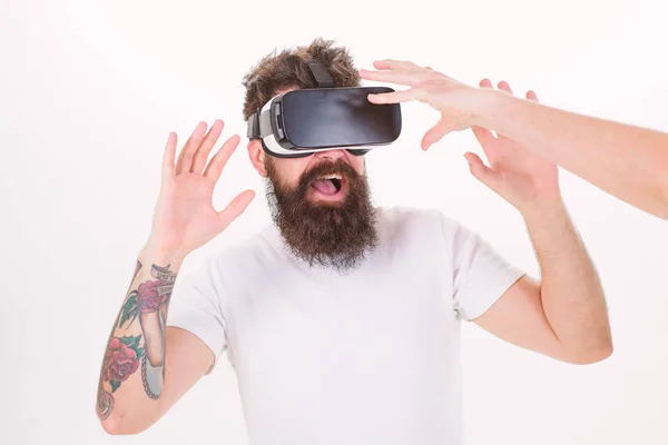 Man with beard in VR glasses, white background. Hipster use modern technologies for entertainment. Guy with head mounted display interact with hand in virtual reality. Virtual reality concept — Stock Photo, Image