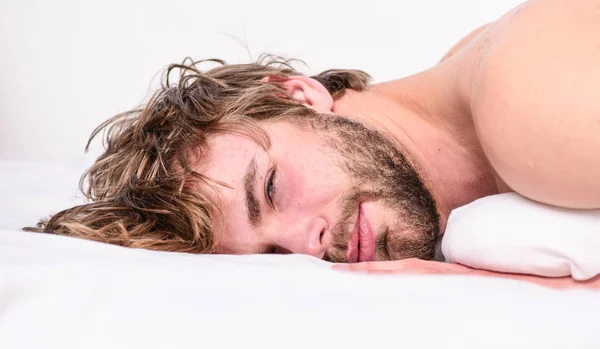 Guy bearded macho relax in morning. Man attractive macho relax and feel comfortable. Simple tips to improve your sleep. Total relax concept. Man unshaven bearded face sleep relax or just wake up — Stock Photo, Image